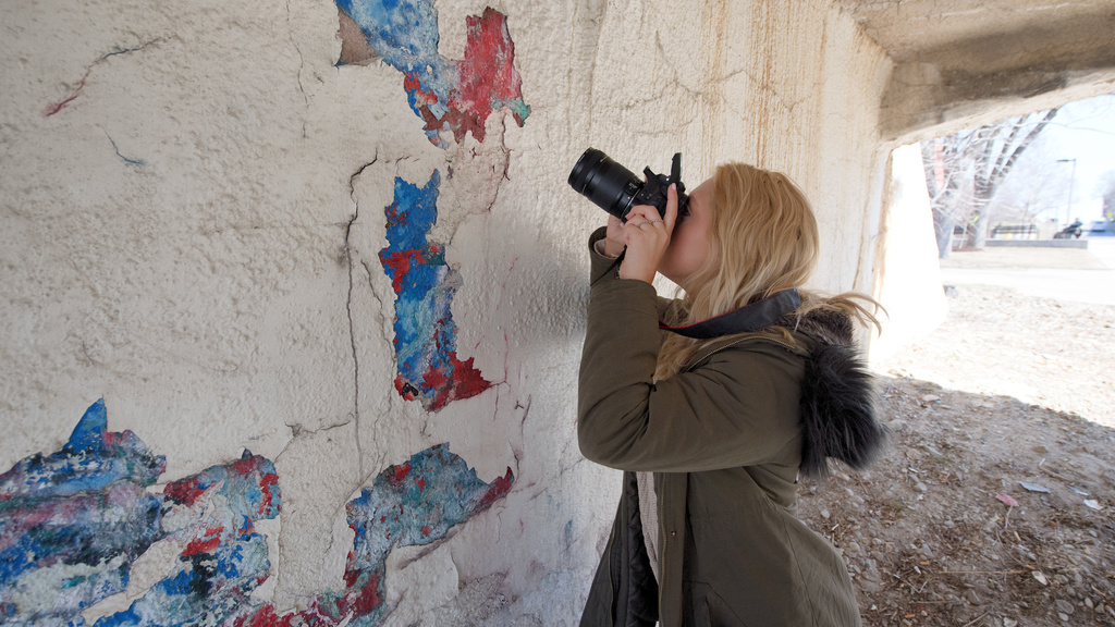 photo student photography outside peeling painted wall